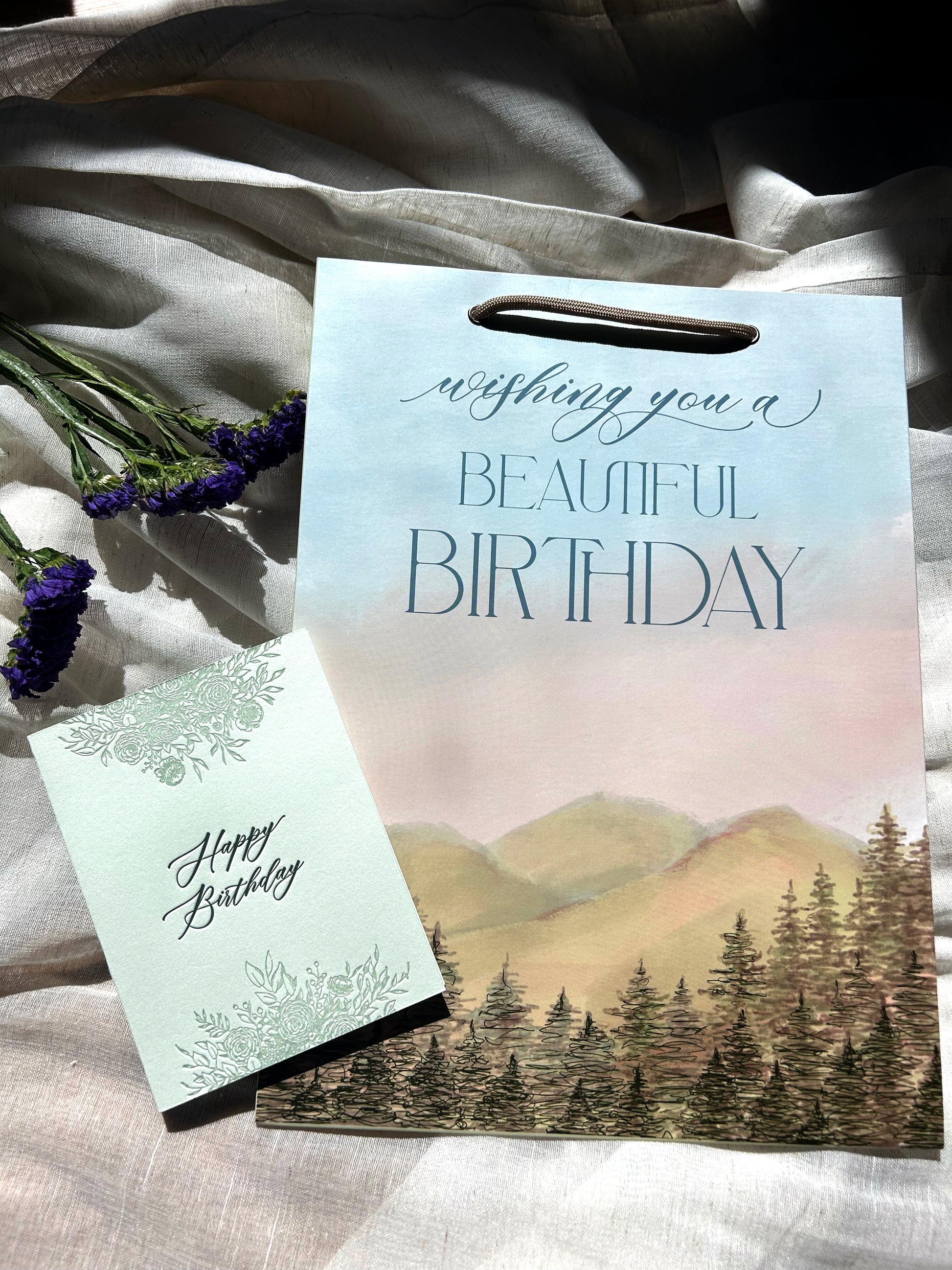 Flatlay photo of birthday card and birthday gift bag by Rust Belt Love