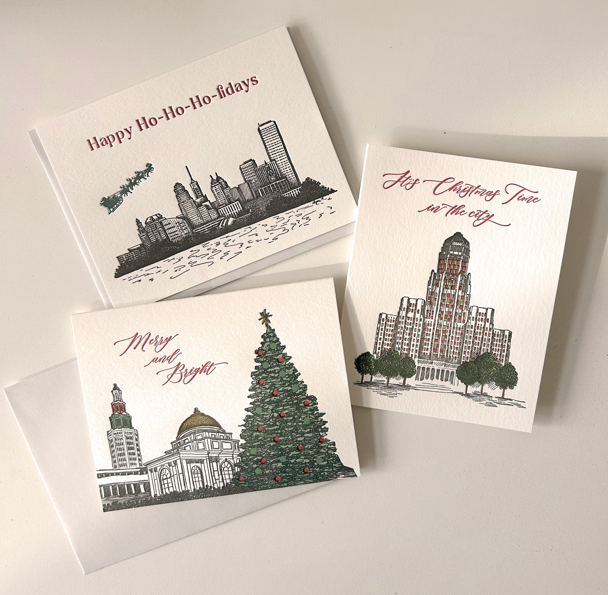 A variety of Buffalo-themed Christmas letterpress cards by Rust Belt Love