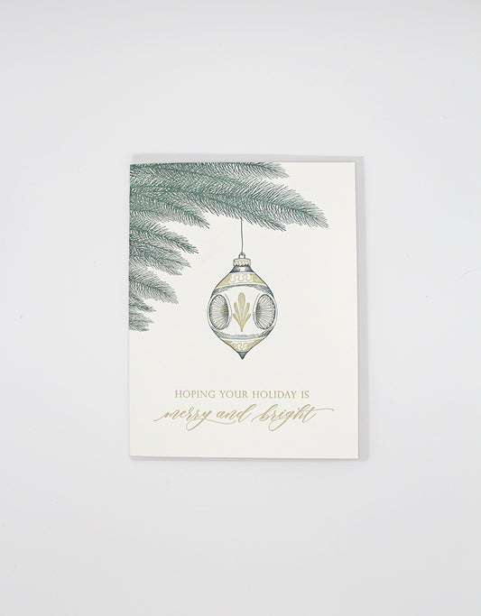 Letterpress holiday card with an ornament on it that reads "hoping your holiday is merry and bright" by Rust Belt Love