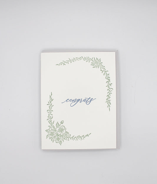 Letterpress congrats card with greenery that says "Congrats" in the middle by Rust Belt Love