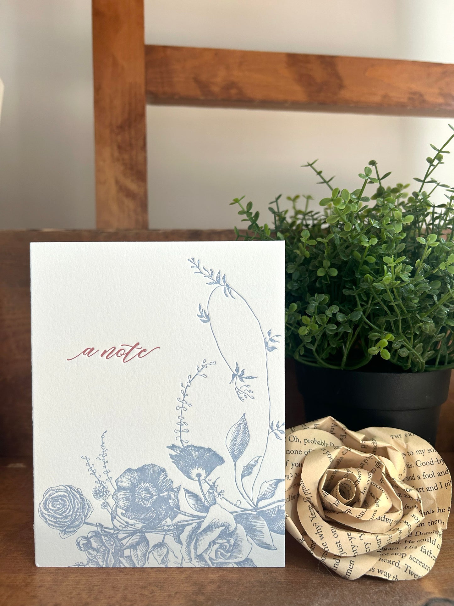 Style shot of letterpress floral greeting card that reads "A note" by Rust Belt Love