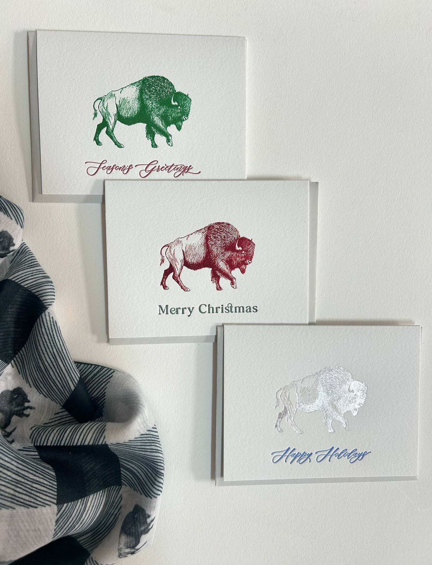 An array of holiday Buffalo foil greeting cards by Rust Belt Love.