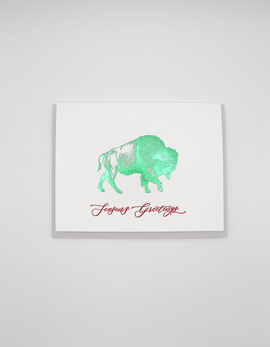 Green foil buffalo holiday card that reads "Season's Greetings" from Rust Belt Love