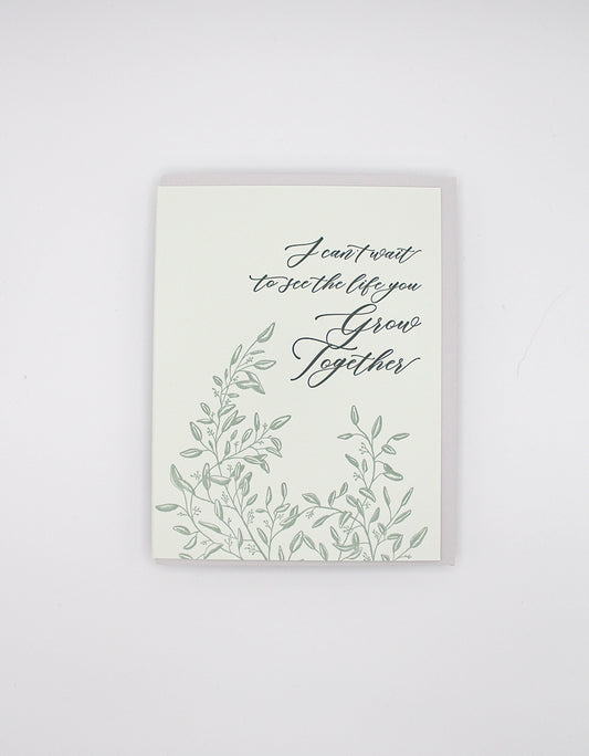 Letterpress wedding card with florals that says "I can't wait to see the life you grow together" by Rust Belt Love