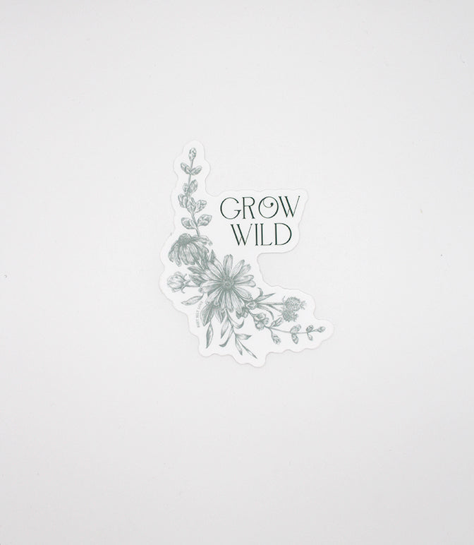 Green floral sticker that says "Grow wild" by Rust Belt Love