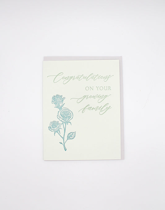 Letterpress congrats card with florals that says "Congratulaions On Your Growing Family" by Rust Belt Love