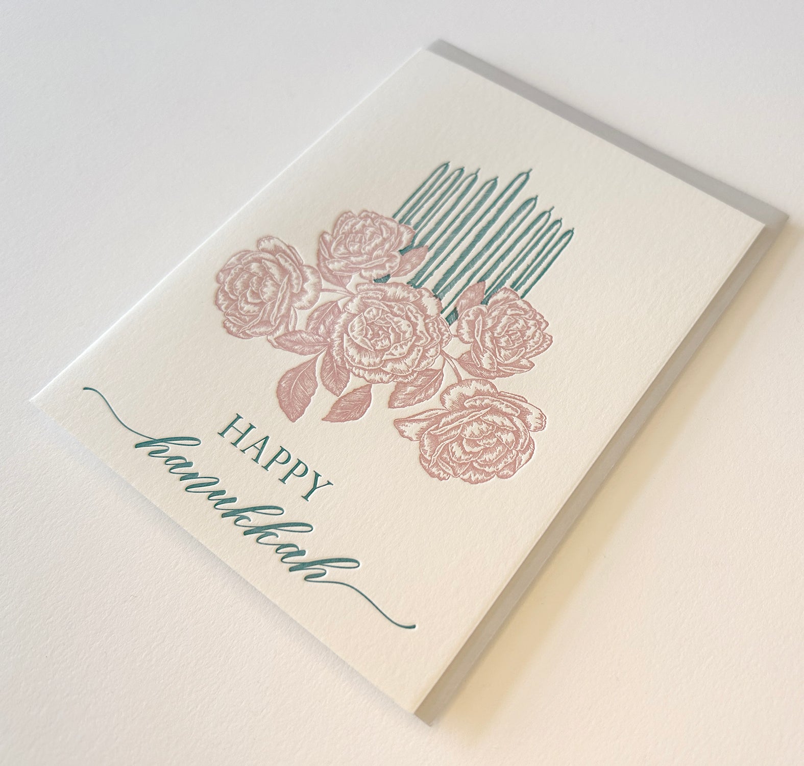 Letterpress holiday card with florals and candles that says "Happy Hanukkah" by Rust Belt Love