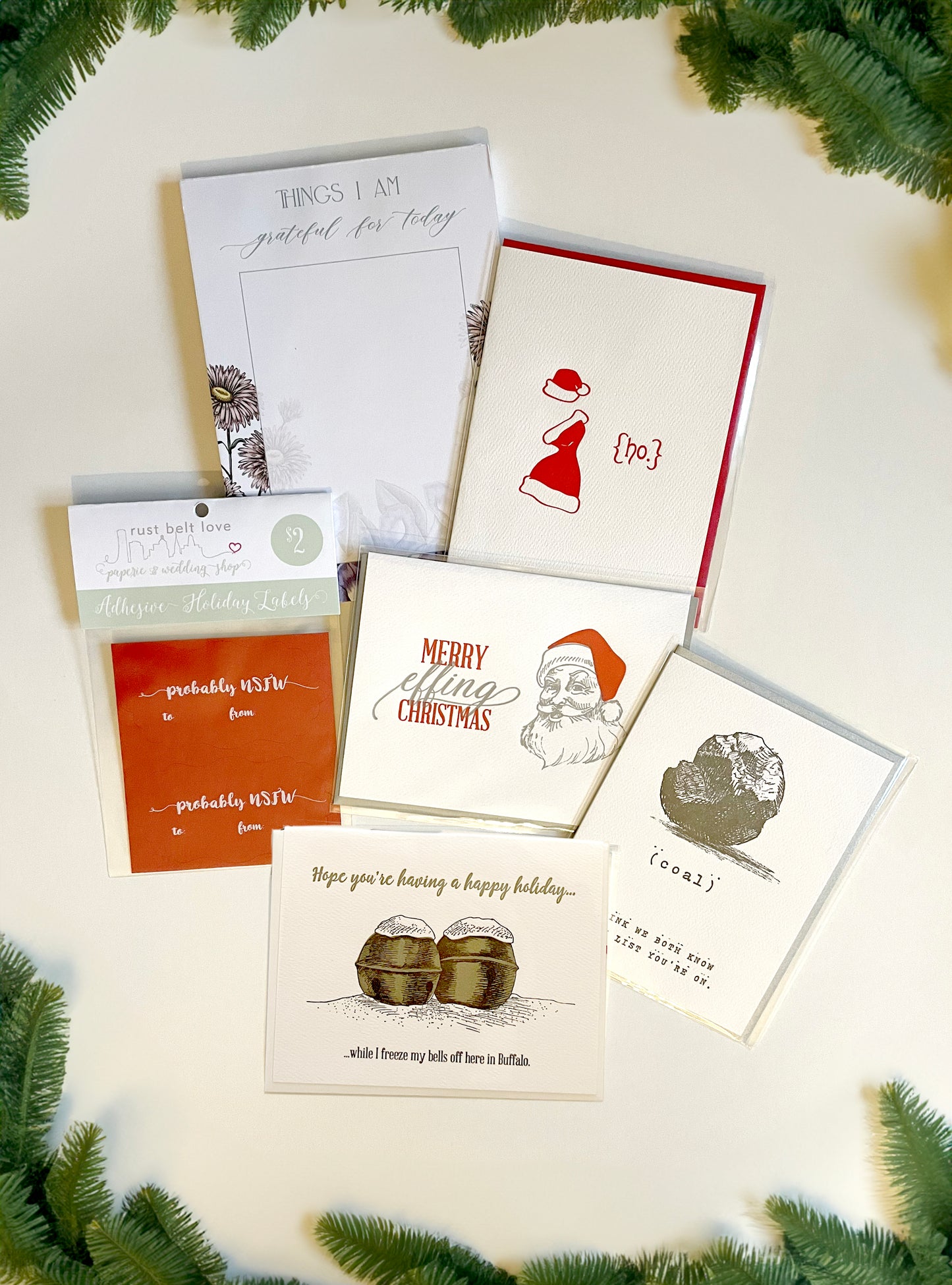 An array of Rust Belt Love's first line of holiday letterpress cards.