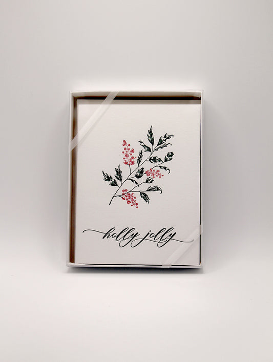 Box of letterpress holiday cards with holly that says "holly jolly" by Rust Belt Love