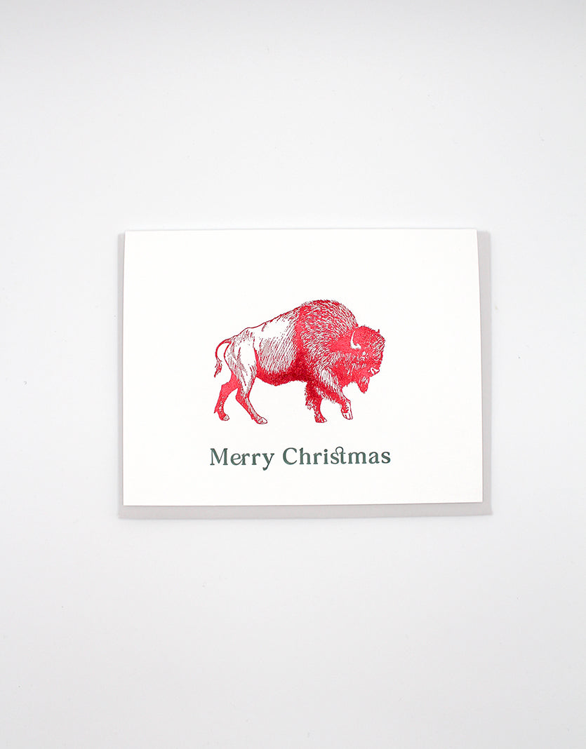 Red foil buffalo greeting card that reads "Merry Christmas" from Rust Belt Love