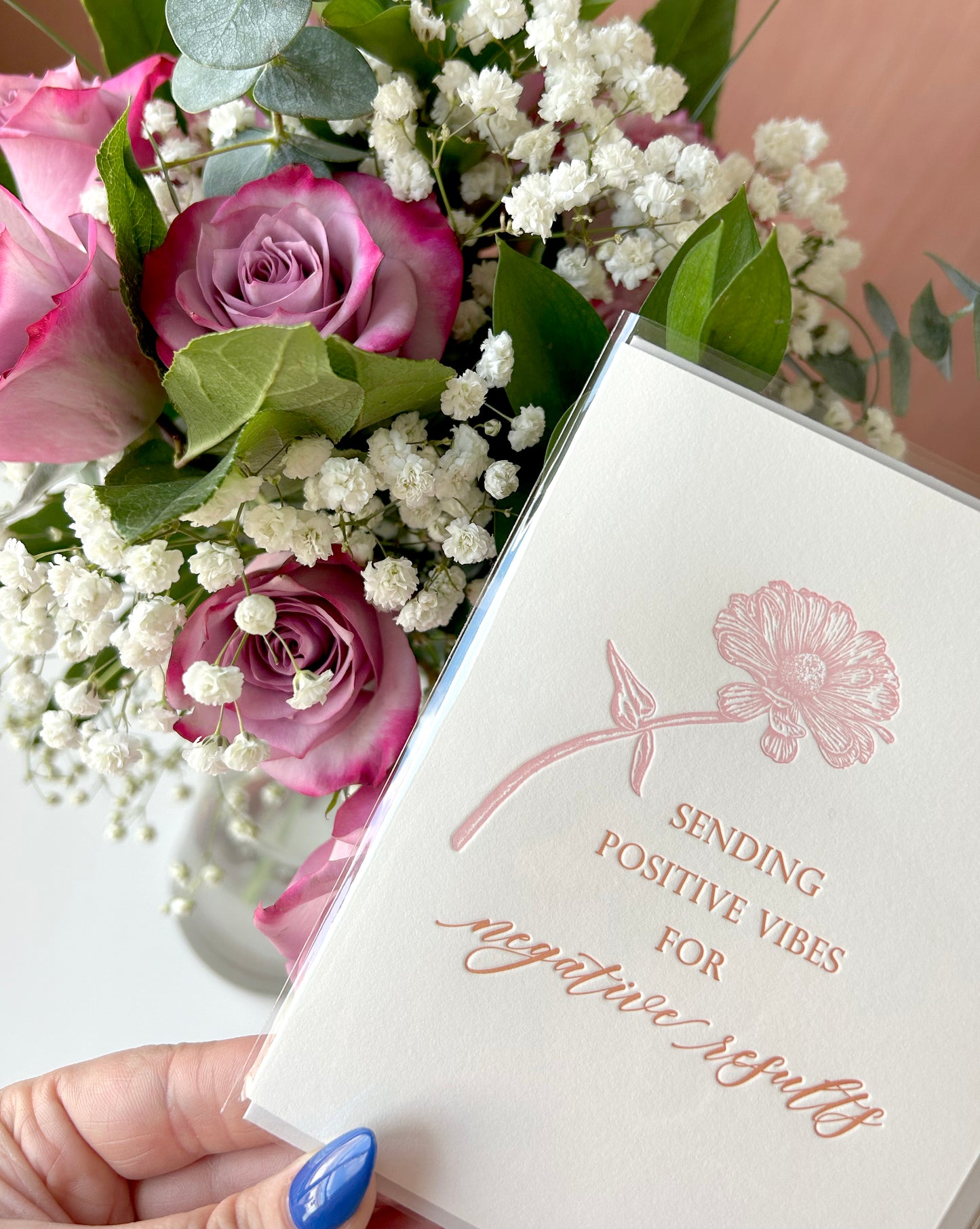 Close up of letterpress friendship card with flower that says "Sending positive vibes for negative results" by Rust Belt Love