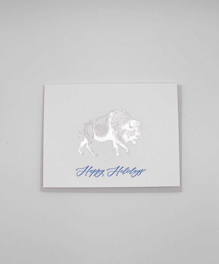 Silver foil buffalo on greeting card that reads "happy holidays" by Rust Belt Love