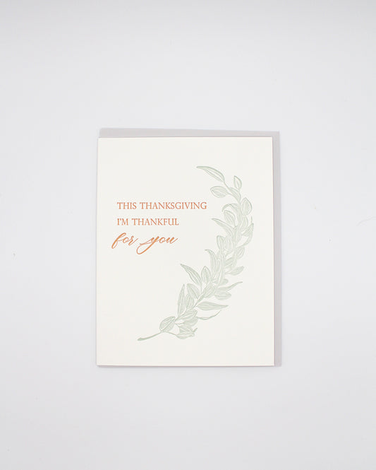 Letterpress thanksgiving card with greenery that says "This Thanksgiving I'm Thankful For You" by Rust Belt Love