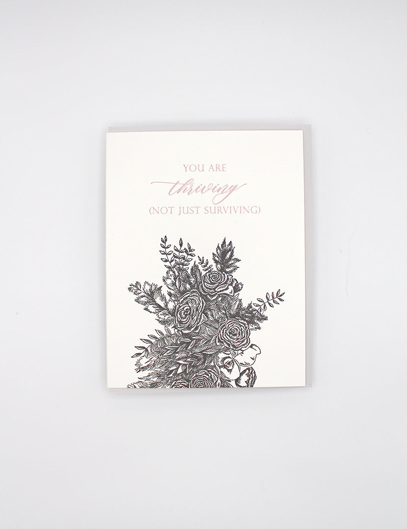 Letterpress friendship card with black florals that says "you are thriving (not just surviving)" by Rust Belt Love