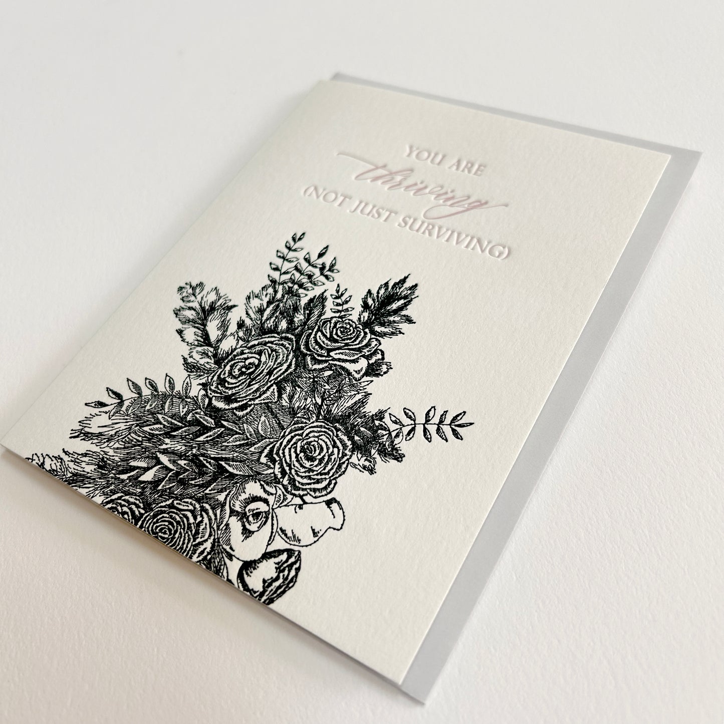 Letterpress friendship card with black florals that says "you are thriving (not just surviving)" by Rust Belt Love