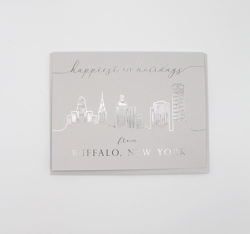 Digital grey foil card with Buffalo skyline that says" Happiest of holidays from Buffalo, New York" by Rust Belt Love